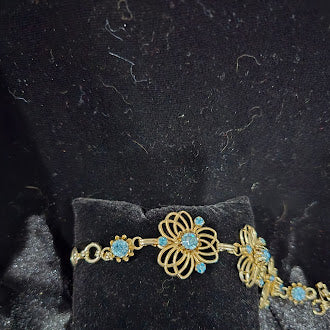 Vintage BSK Gold Tone Blue Rhinestone Bracelet and Clip Earrings Set with Floral Filigree Links, Mid Century Glam, Curated Estate Style