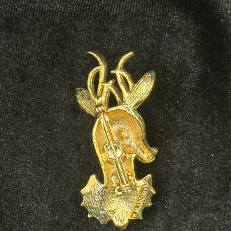 Gold-tone reindeer head Christmas brooch with green rhinestone eye, red nose and holly, view 3