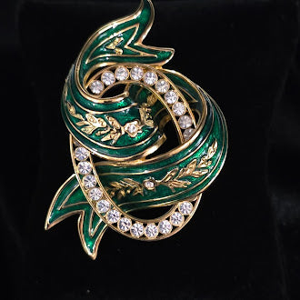 Signed Joan Rivers gold-tone ribbon swirl brooch with green enamel and clear crystals, view 2