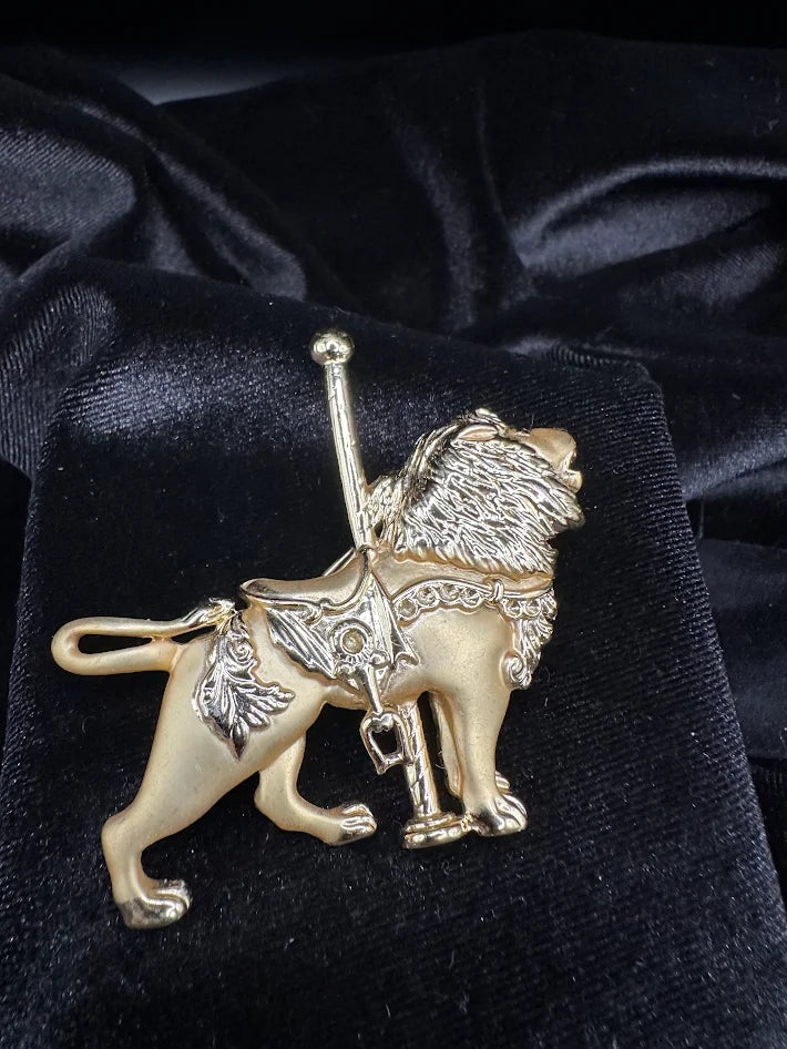 Vintage Enamel Gold tone carousel lion brooch with textured mane and saddle detail