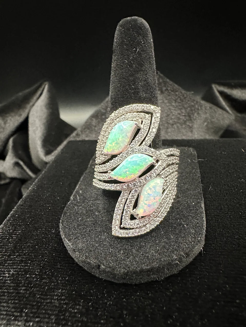 Silver-tone wrap ring with three iridescent opal-look marquise stones and clear crystals, view 2
