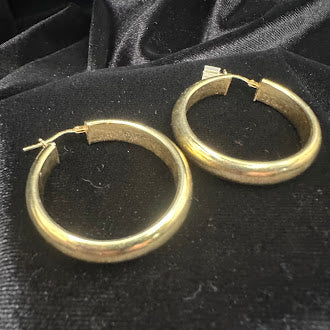 Polished gold-tone tubular hoop earrings with hinged closure, view 3