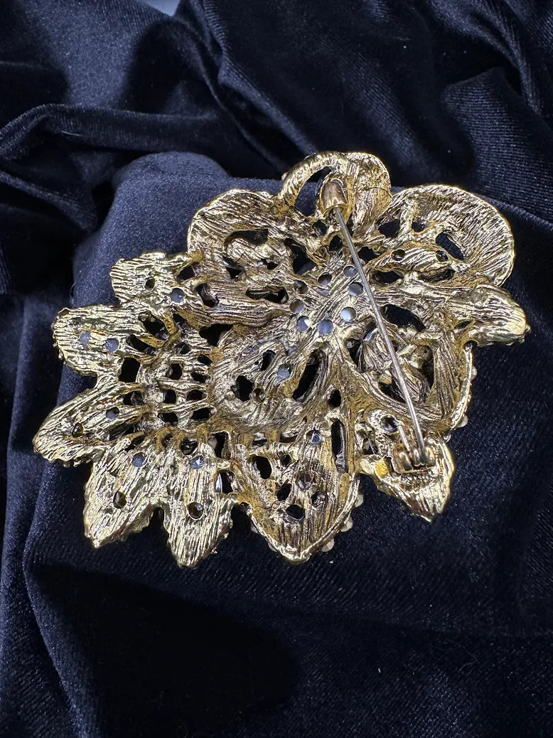 Large gold-tone floral brooch with pear-shaped purple center and pink, violet and aurora stones, view 6