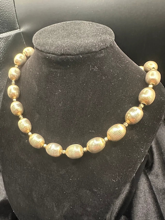 Signed Trifari gold-tone textured oval bead necklace, view 3